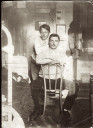 1913, Илья Васильевич Калмыков (стоит) и Дмитрий Васильевич Калмыков (сидит). [№ 01043]